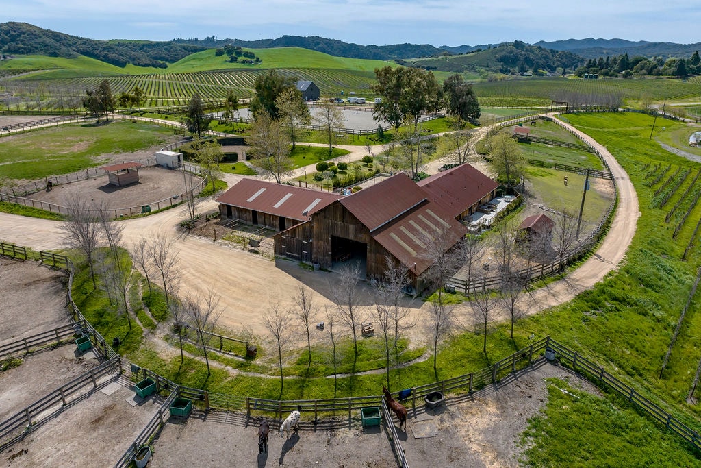 Aerial view of farm buildings and surrounding fields